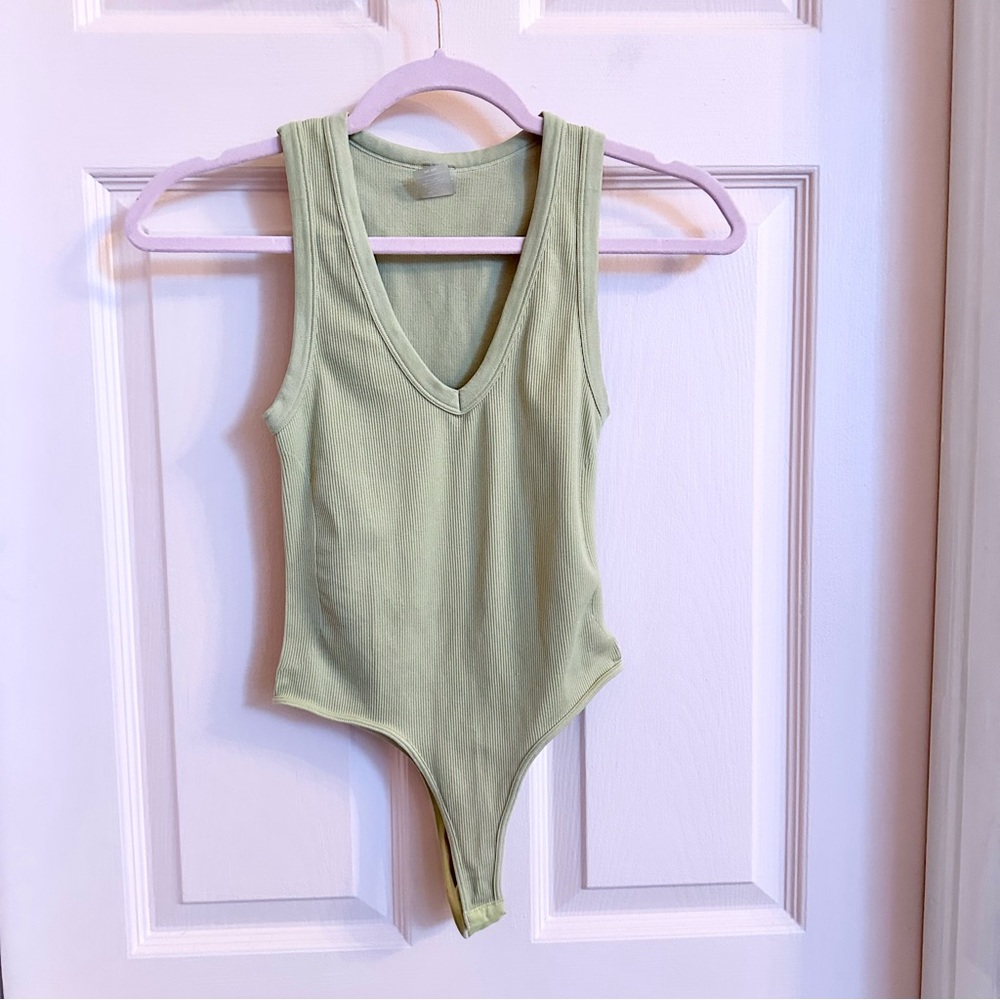 Green ribbed dynamic bodysuit